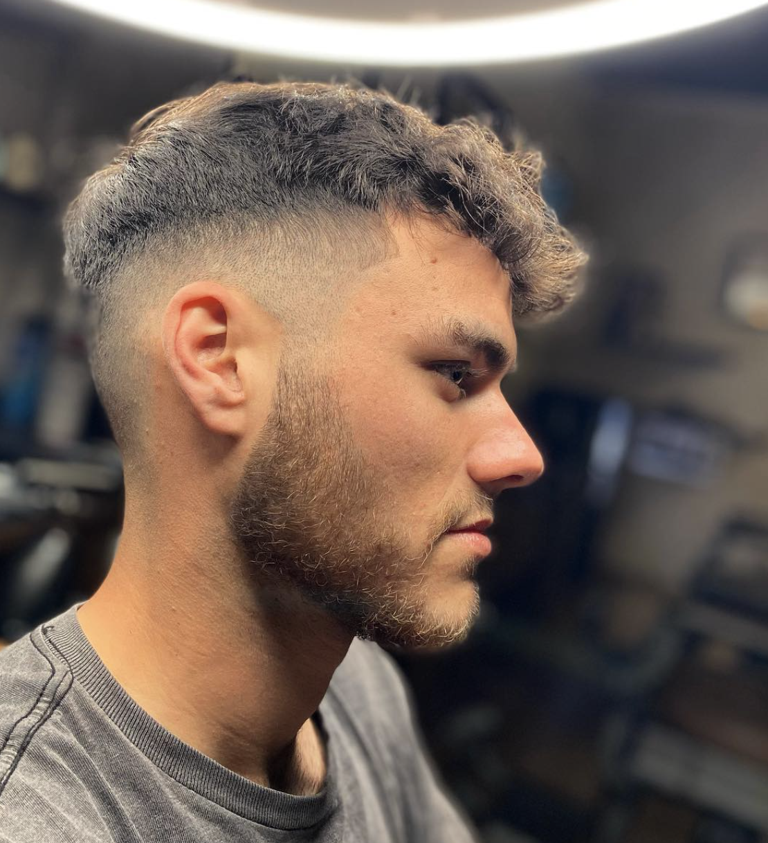 Curly crop with a fade and shaped beard done at The Barber's History