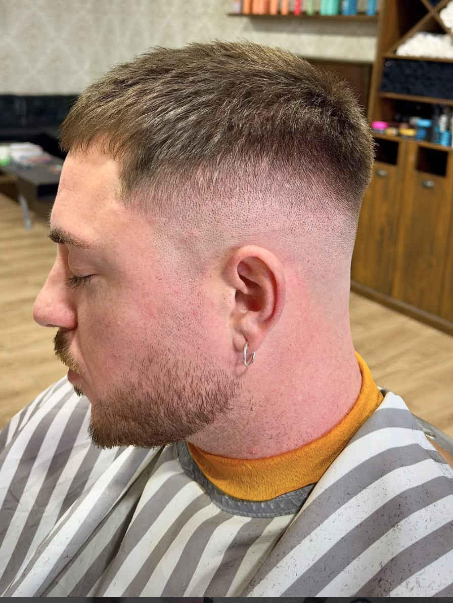 Low fade with textured top and shaped beard done at The Barber's History