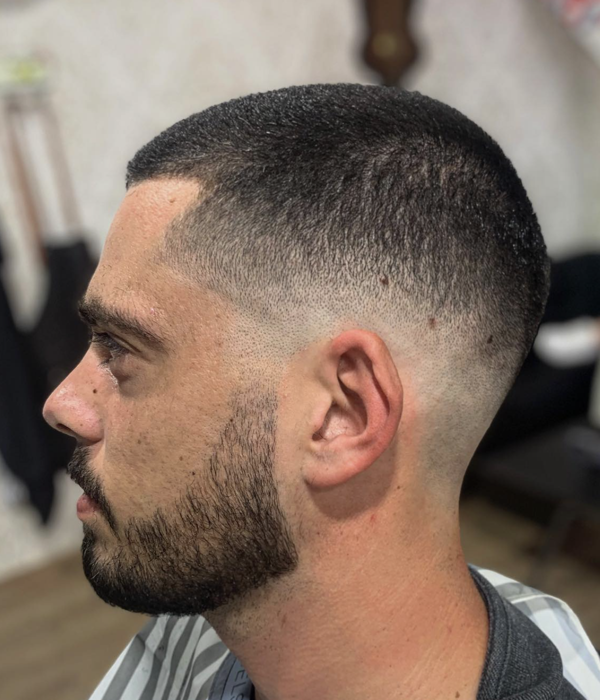 Buzz cut with a clean fade and defined beard done at The Barber's History